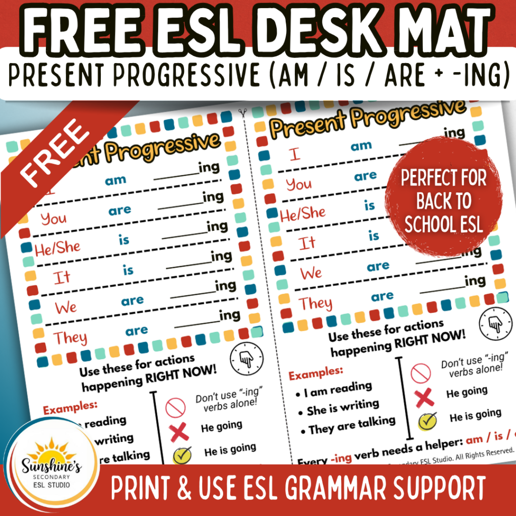 ESL students using a present progressive desk mat to practice am is are plus ing verbs in a high school classroom