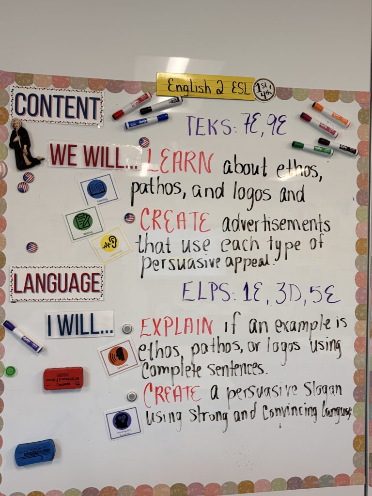 High school ESL content and language objectives displayed on a classroom dry-erase board